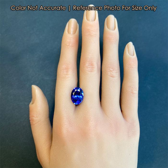 violet blue tanzanite oval cut on hand 