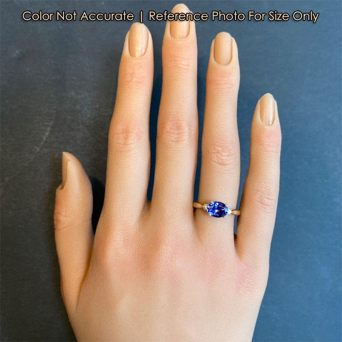 size of east west tanzanite ring on hand