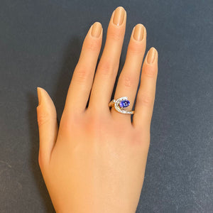 oval cut tanzanite and channel set diamond ring yellow gold