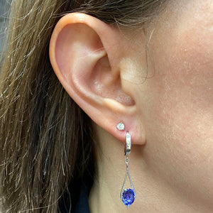 oval cut tanzanite earrings hinged lever back