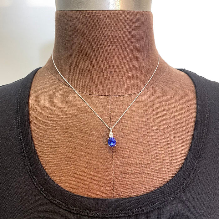 oval tanzanite with pear shape diamond pendant white gold