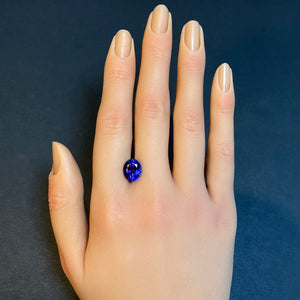 oval tanzanite with red flash gemstone