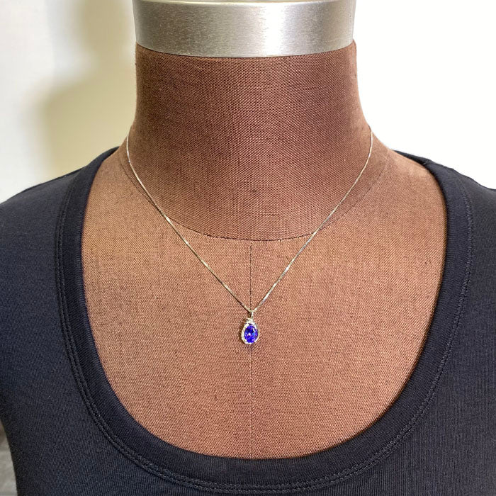 oval tanzanite in white gold setting with diamonds