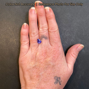 hand size reference of tanzanite pear shape on hand