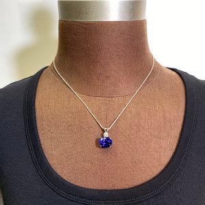 oval tanzanite with diamond white gold pendant