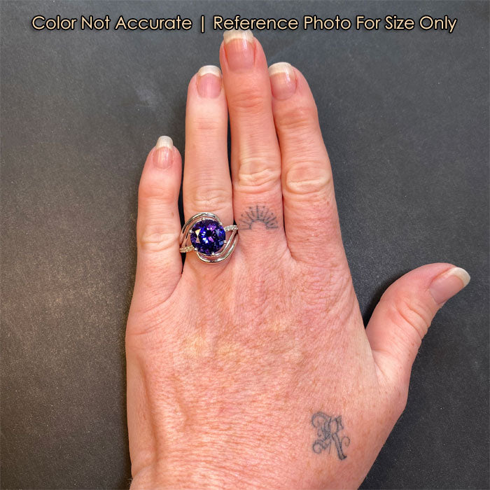 white gold tanzanite and diamond ring on hand