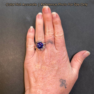 white gold tanzanite and diamond ring on hand