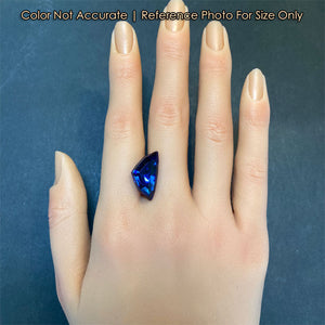 large blue shield tanzanite gem on hand 