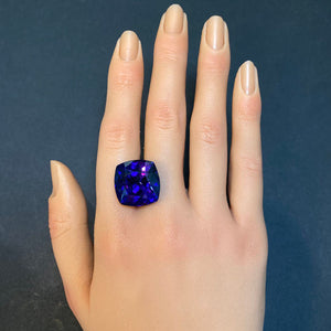large tanzanite gem on hand 