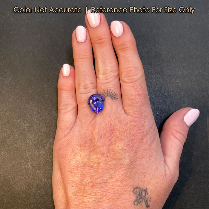 tanzanite gemstone shield cut on hand 