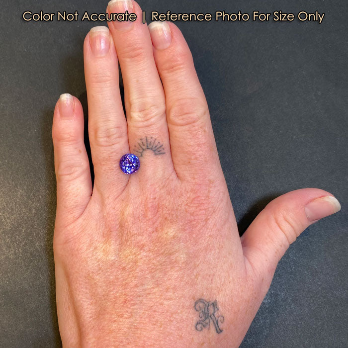 round brilliant mostly violet tanzanite gem size