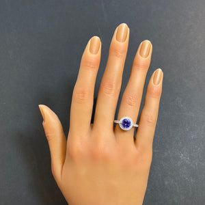 round tanzanite and diamond band and halo ring white gold