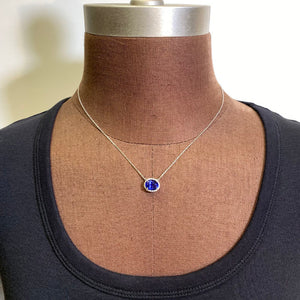 oval tanzanite diamond halo pendant