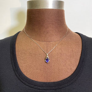 white gold oval tanzanite pendant 