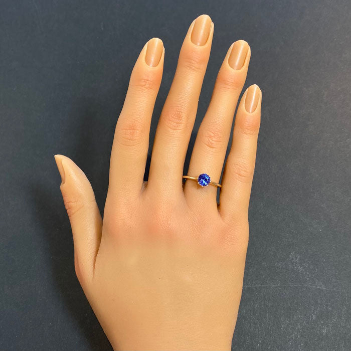 round tanzanite solitaire in yellow gold ring