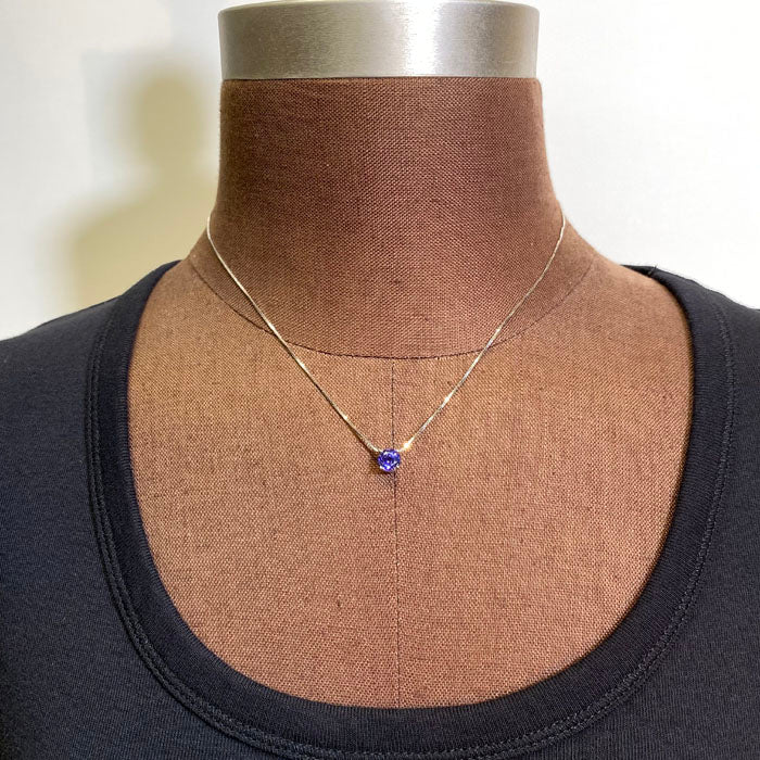 round tanzanite floating white gold