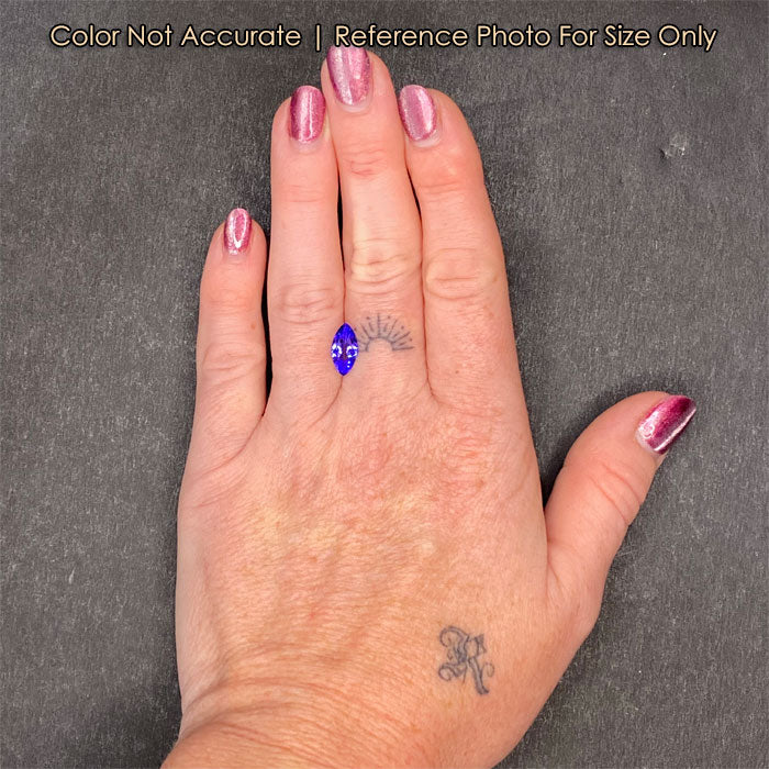 tanzanite gemstone on hand 