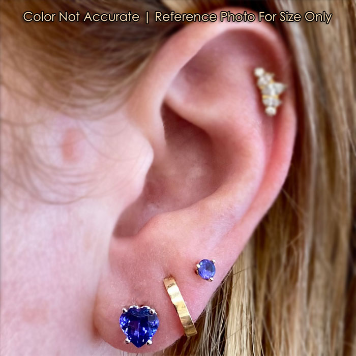 tanzanite heart shape earring on ear in white gold 