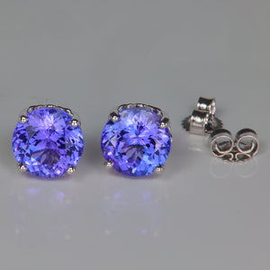 blue violet tanzanite gemstone earrings in white gold