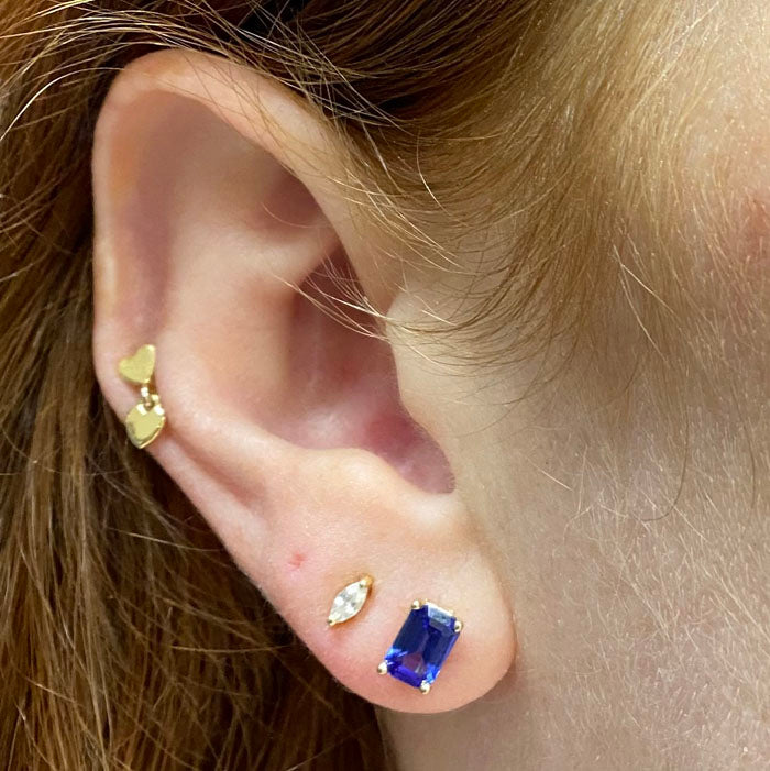 emerald cut tanzanite set  in yellow gold stud earrings