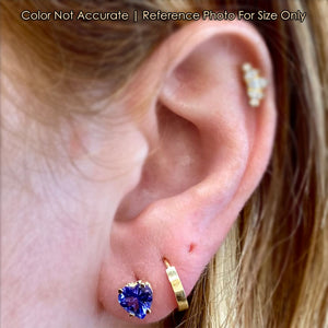 tanzanite heart shape earrings on ear