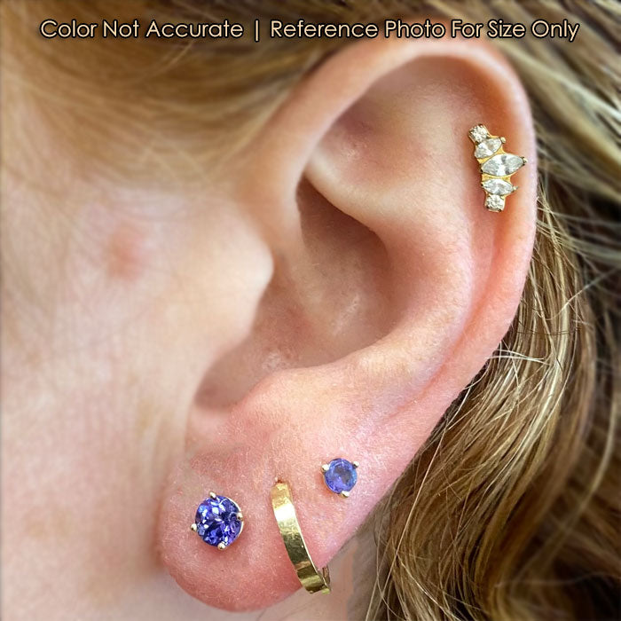 tanzanite gemstone earrings in yellow gold
