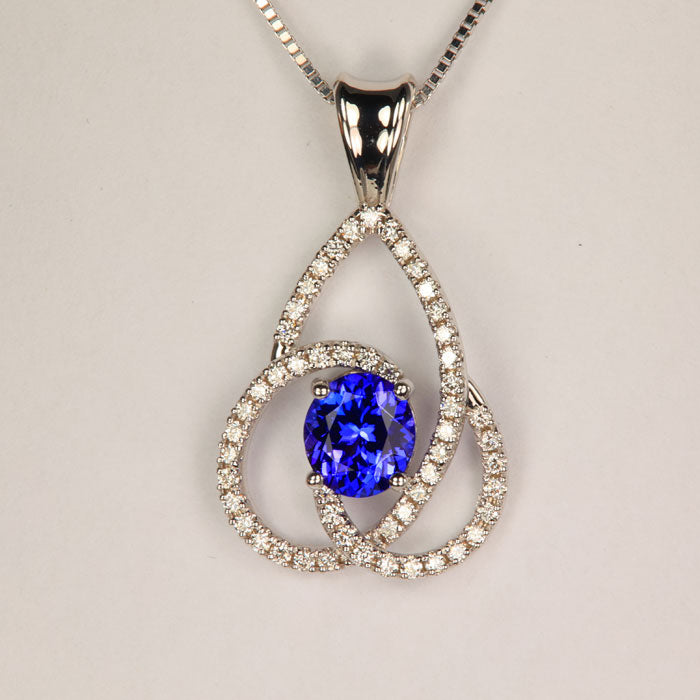 Oval Tanzanite Pendant with Diamond Swirls in white gold