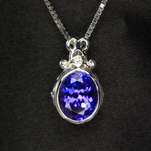 bezel set tanzanite pendant with diamonds