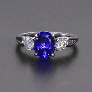 Blue Violet Oval Tanzanite Ring with Diamond Accents 2.27 Carats