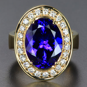 Large Oval Tanzanite and Diamond Halo Ring