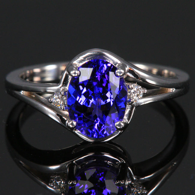 14K white gold oval tanzanite ring with 2 side diamonds