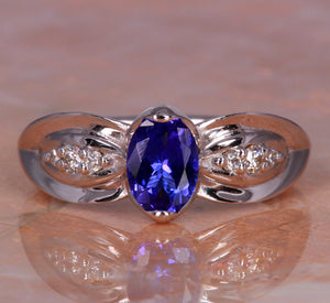White Gold Tanzanite Ring With Intense Oval Tanzanite and Ideal Cut Diamonds