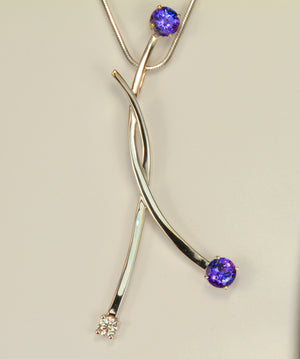 Large uniquely styled pendant with tanzanites