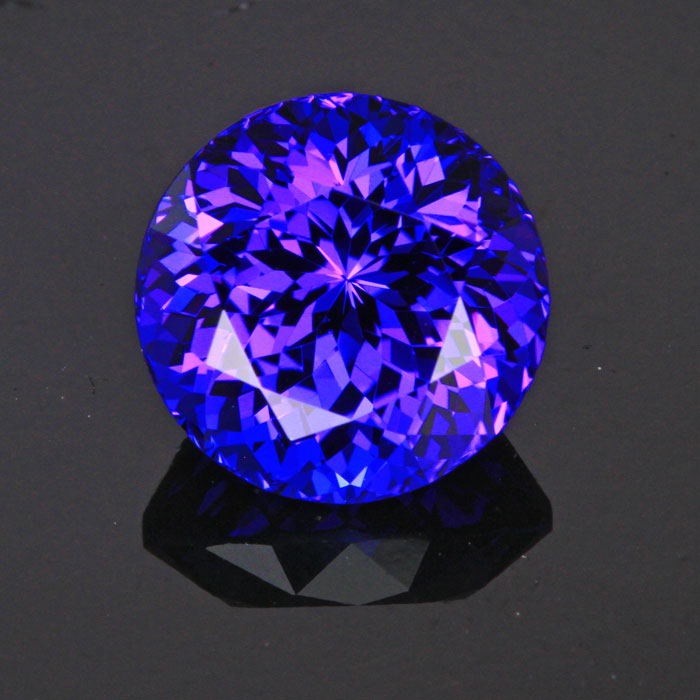 round tanzanite gemstone red flashes