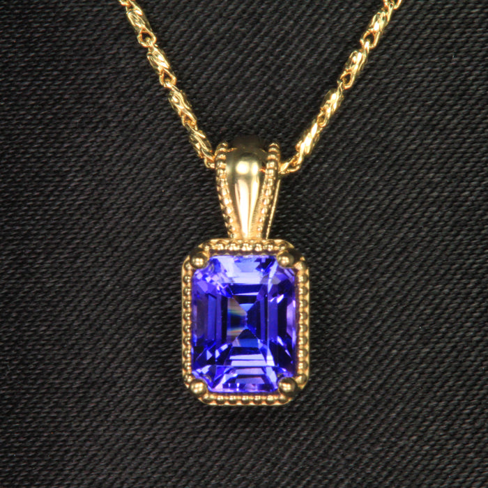yellow gold emerald cut tanzanite pendant
