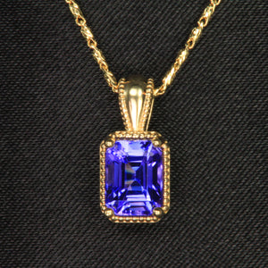 yellow gold emerald cut tanzanite pendant